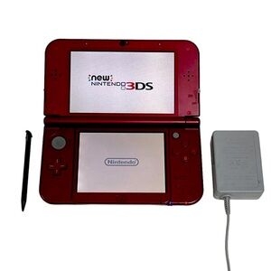 New Nintendo 3DS XL Red with game, chargers, two stylus, one owner minimal wear